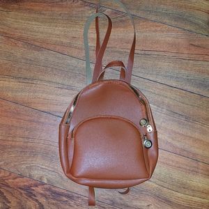 Womens brown adjustable backpack purse NWOT